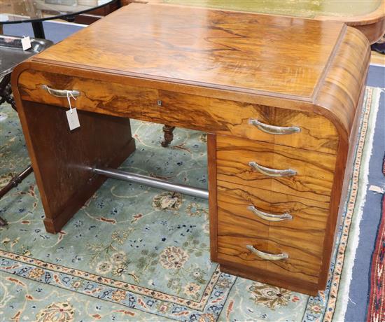 An Art Deco figured walnut desk W.109cm